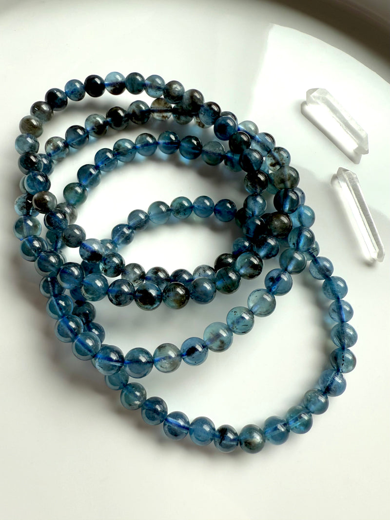 Deep blue Aquamarine Bracelets aka Devil Aquamarine photographed in natural light on a white plate