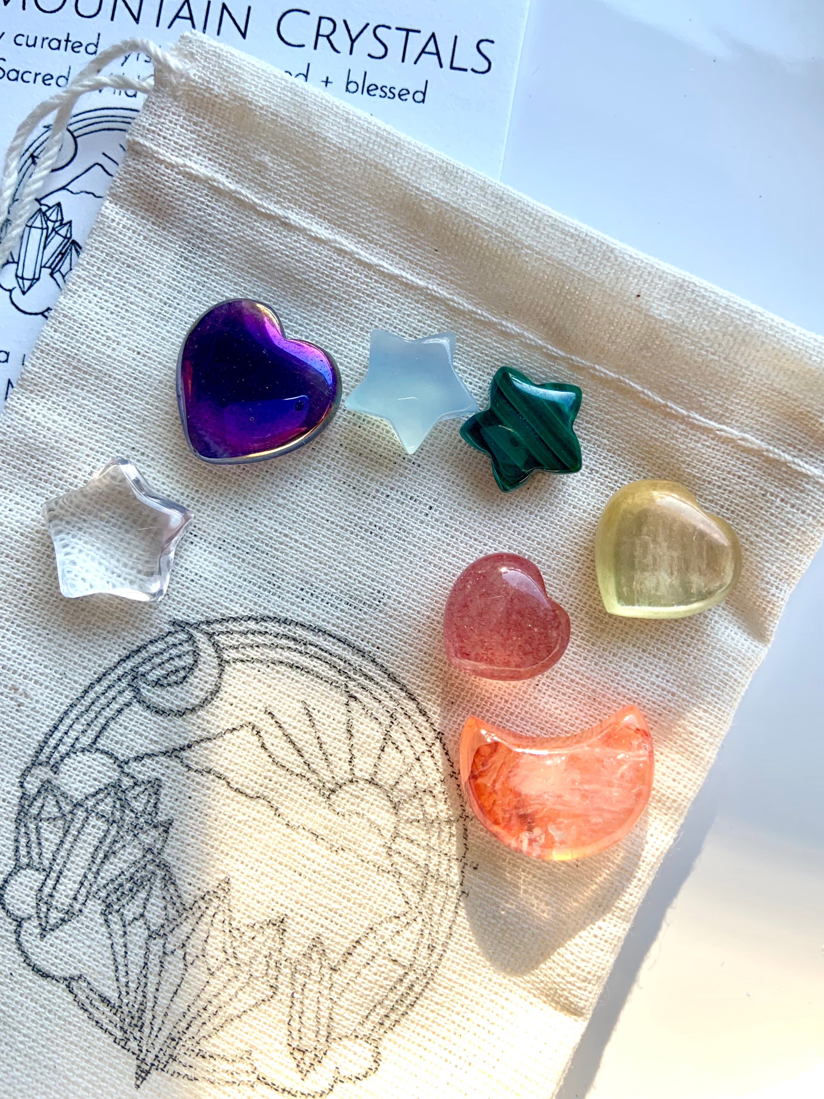 Premium chakra crystal set of 7 mini carved gems in high-vibe rainbow heart, moon & star shapes