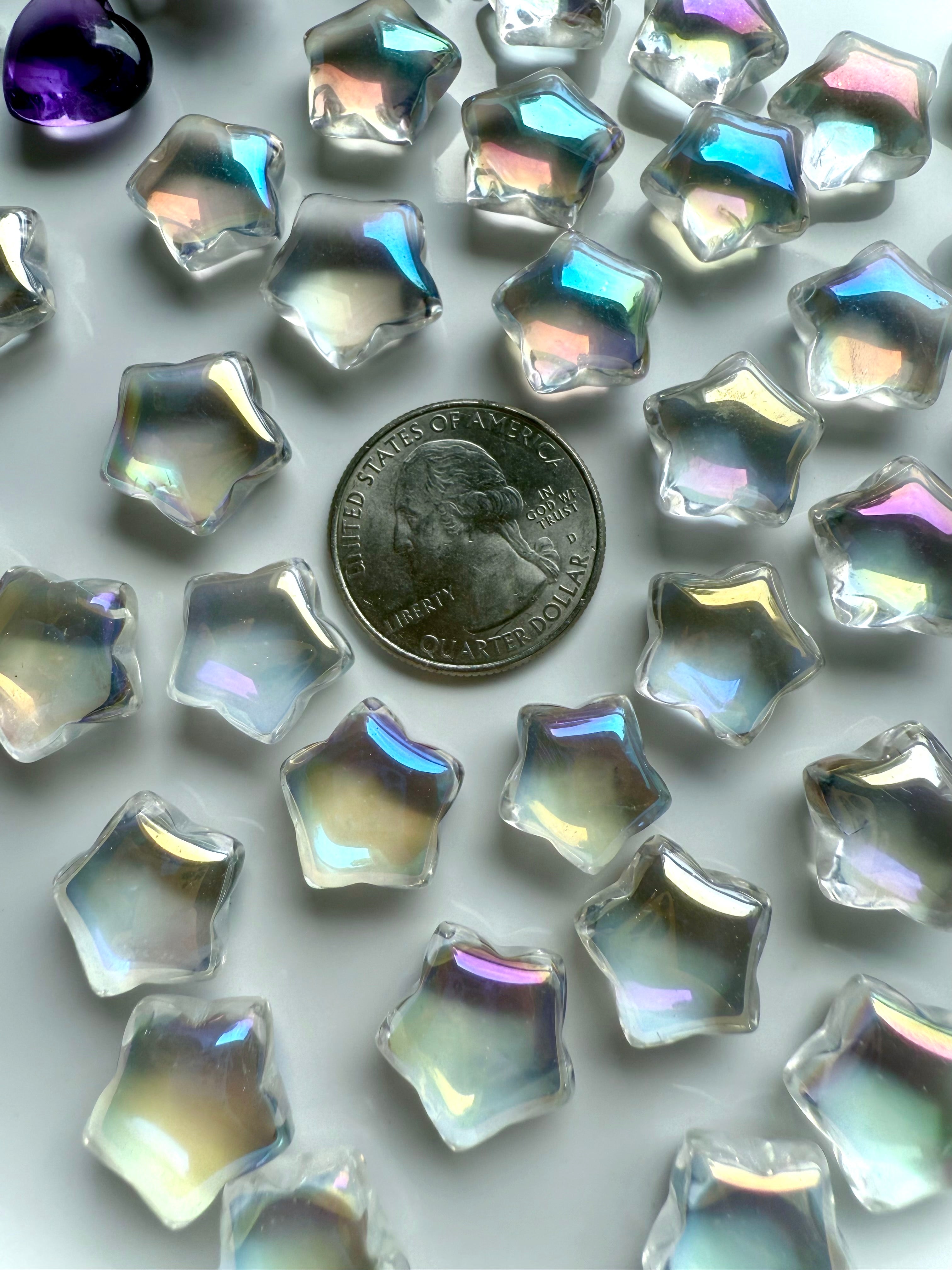 Mini aura quartz stars shown beside quarter coin for size reference — opalescent rainbow crystals for grids, gifts, and altar décor