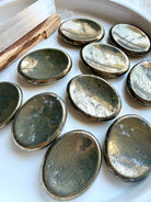 Pyrite worry stones with brilliant metallic gold luster and natural mineral inclusions for abundance and confidence