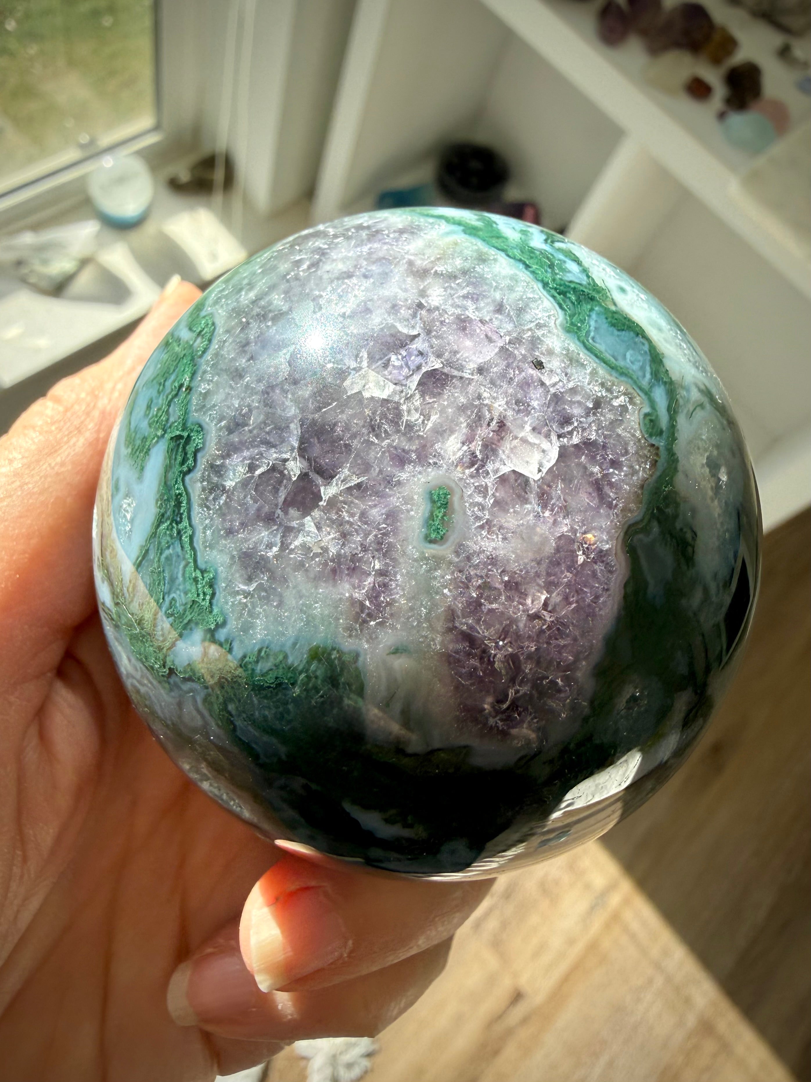 Amethyst druzy surrounded by Moss Agate in a rare crystal sphere with purple and green natural patterns