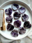 dream amethyst heart worry stones on dish with selenite for calm intuition and clarity