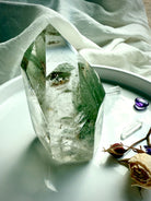 Chlorite Phantom Garden Quartz point with shimmering inclusions and polished flat base