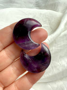 High quality deep purple Dream Amethyst Moons shown on my fingertips for scale