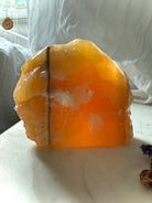 Large translucent Orange Calcite display specimen from Mexico with glowing honey orange color and natural mineral banding