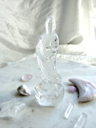 Clear Quartz Quan Yin statue carved from luminous crystal with exceptional clarity and serene goddess details