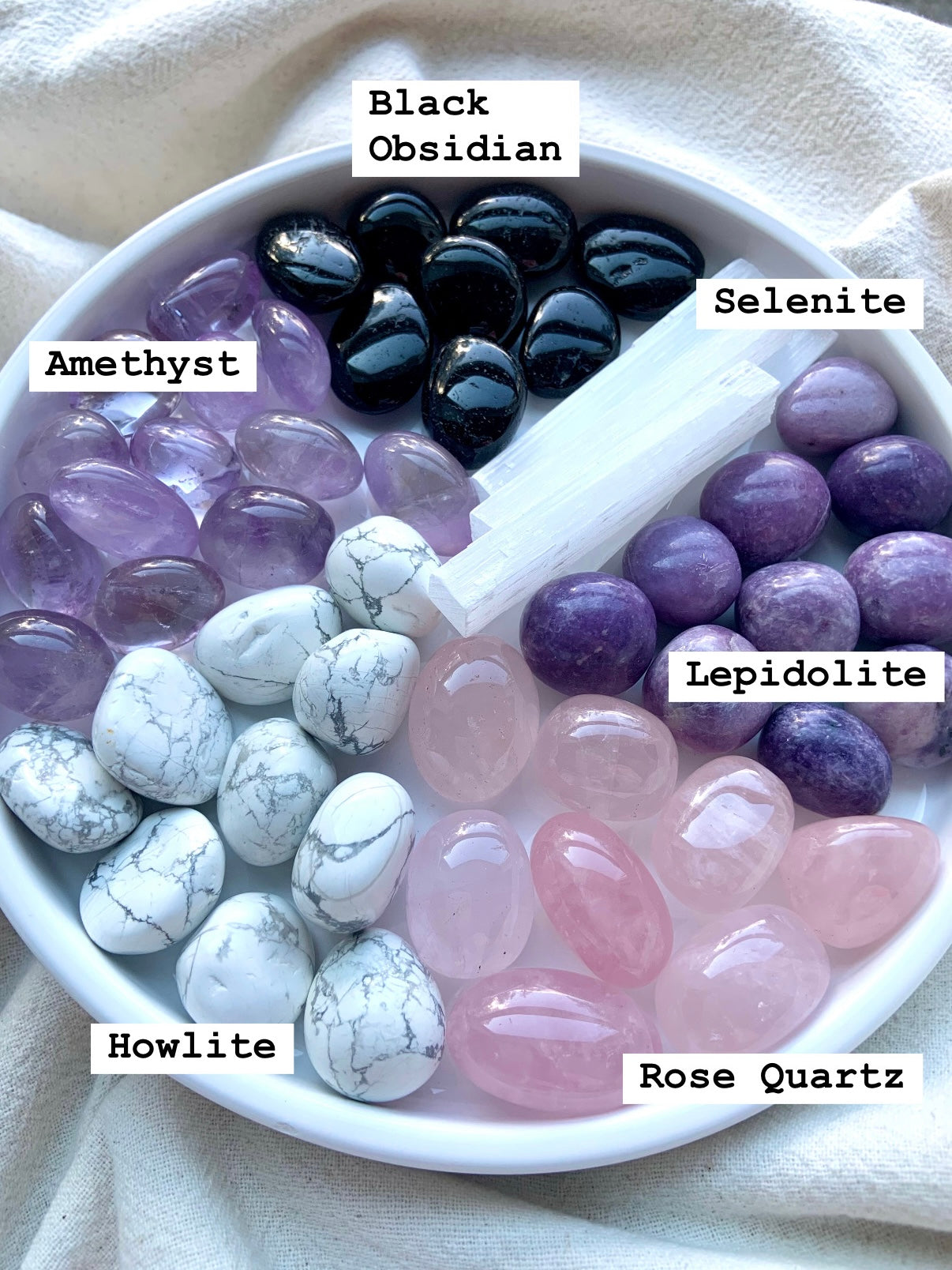 Sleep crystal set stones in a bowl: amethyst, obsidian, rose quartz, howlite, lepidolite, selenite