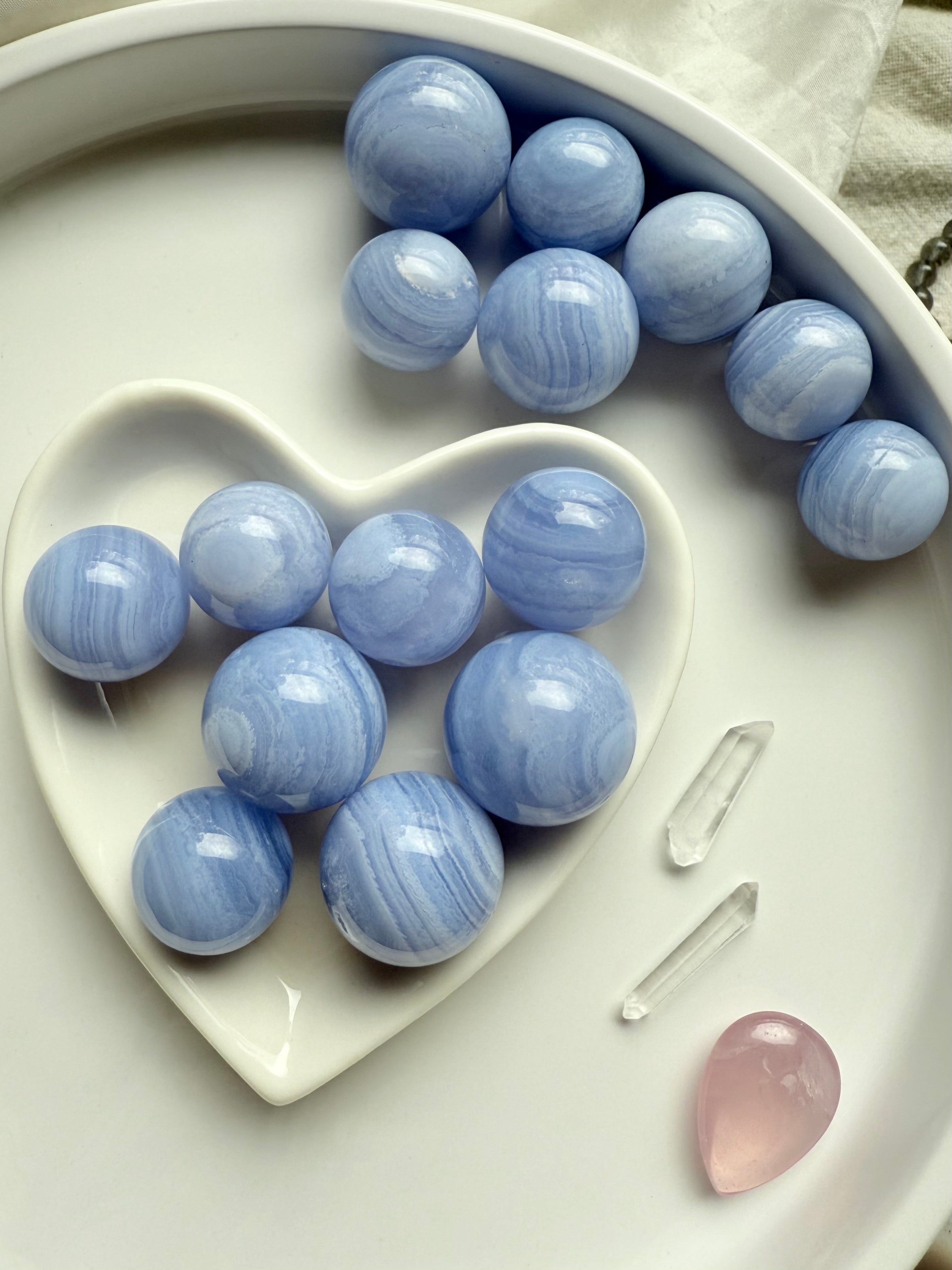 Soothing Blue Lace Agate is a throat chakra crystal of clear, heart-centered communication.
