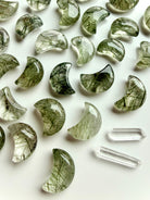 Tourmalinated Quartz moon crystals with green tourmaline inclusions arranged with Clear Quartz points