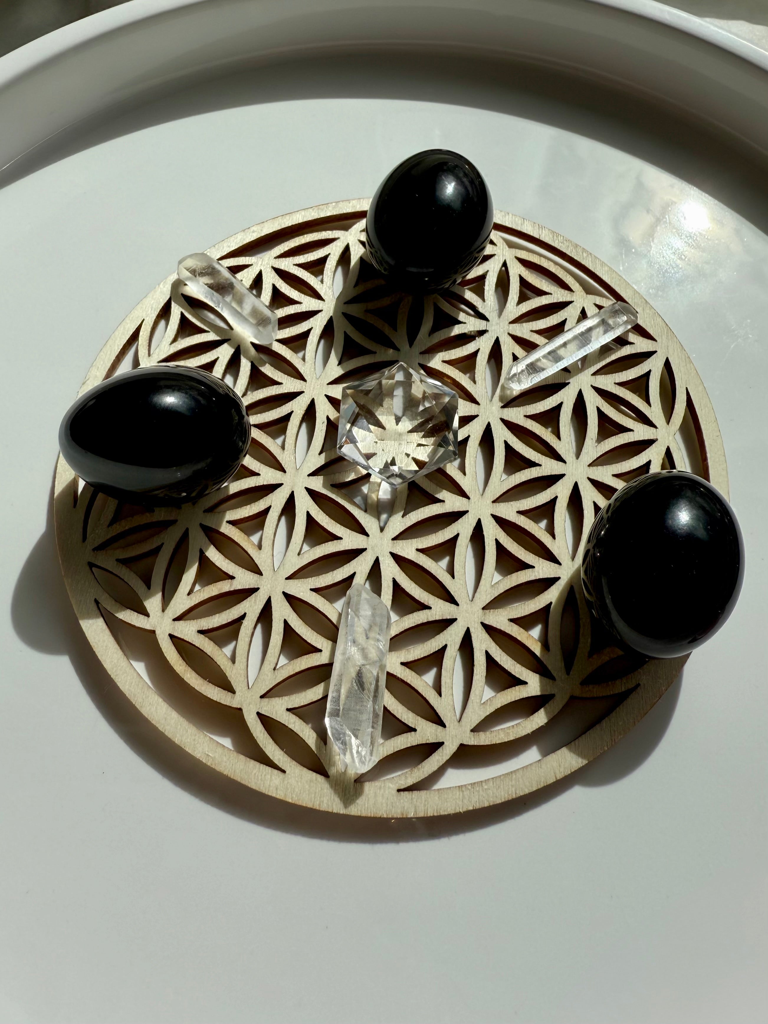 A crystal grid for energetic protection made with our Black Obsidian Tumbles