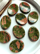 unakite worry stones on dish oval thumb stones for grounding emotional balance and heart healing