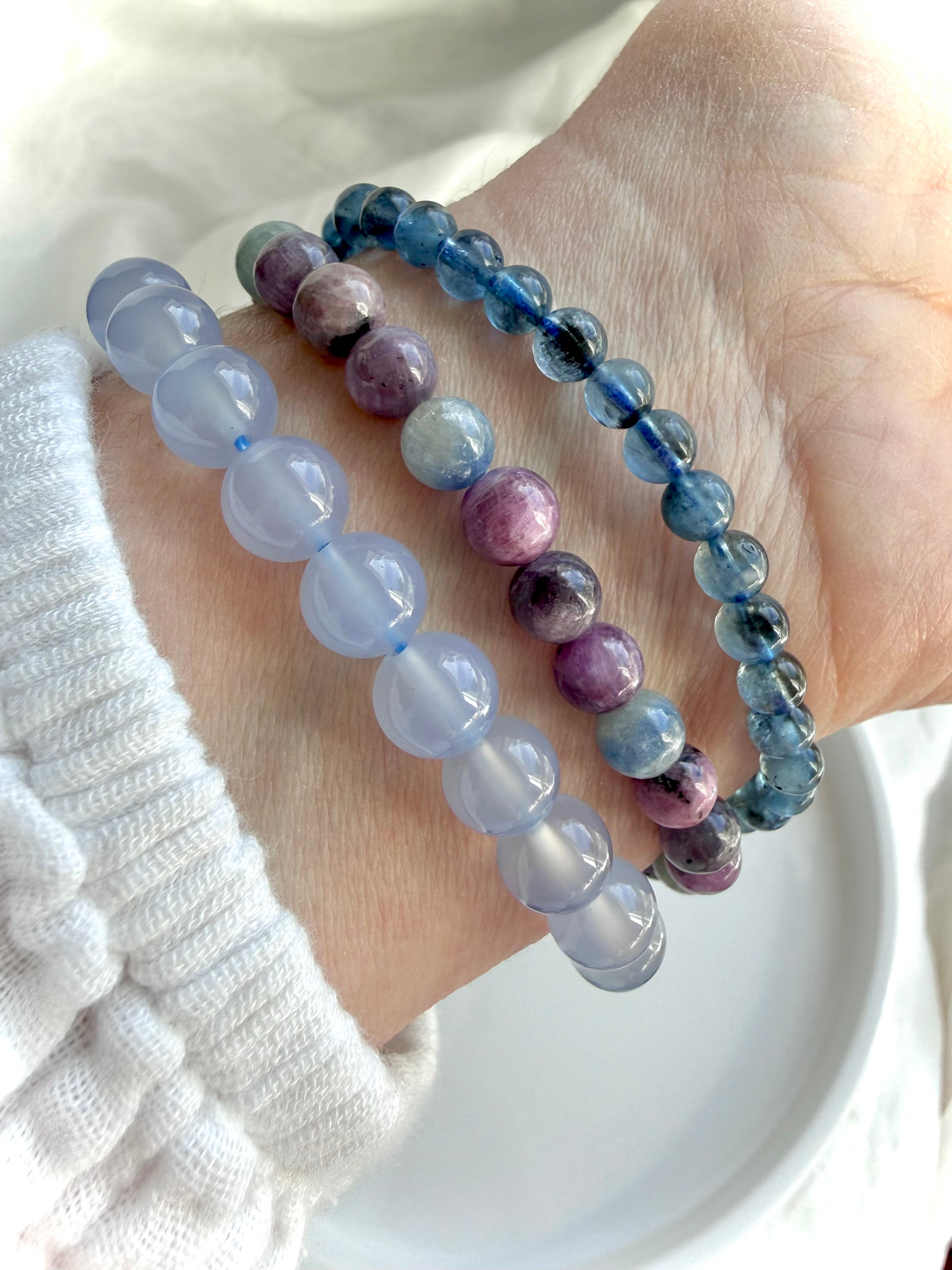 Ruby Sapphire bracelets worn with blue chalcedony & aquamarine crystal bracelets for gemmy stacking ideas