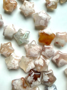 Assorted Flower Agate stars with translucent chalcedony, floral plumes, and natural blush pink variation