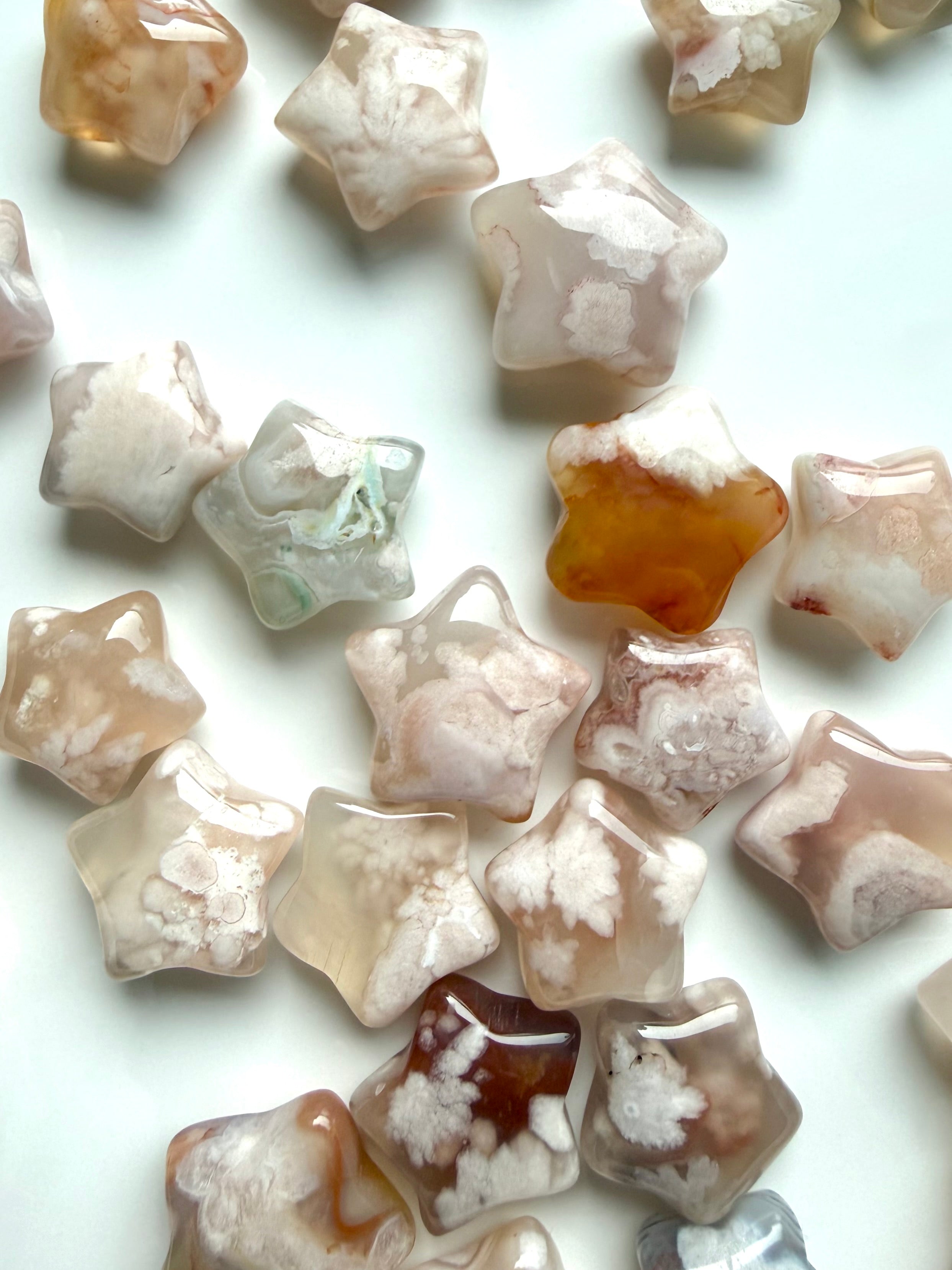 Assorted Flower Agate stars with translucent chalcedony, floral plumes, and natural blush pink variation