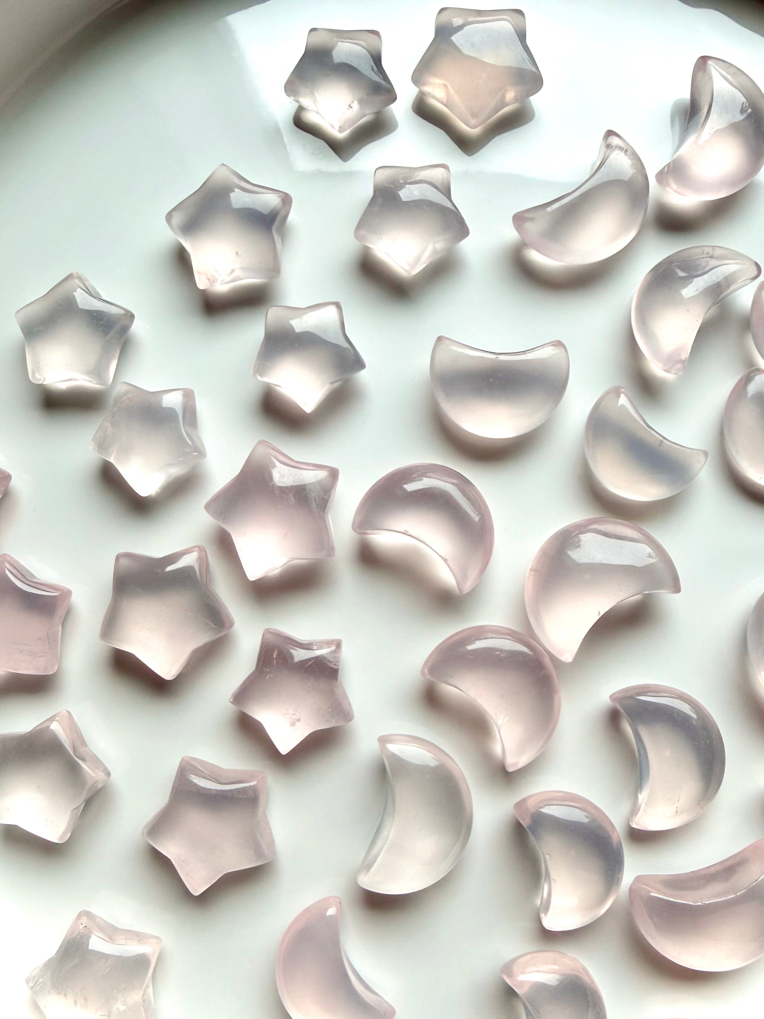 Rose Quartz mini moons and stars with soft pink translucence and natural variations in shape and clarity