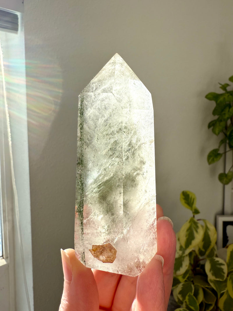 A Garden Quartz Crystal Tower with a stack of Chlorite Phantoms offering Earth wisdom from Mama Gaia