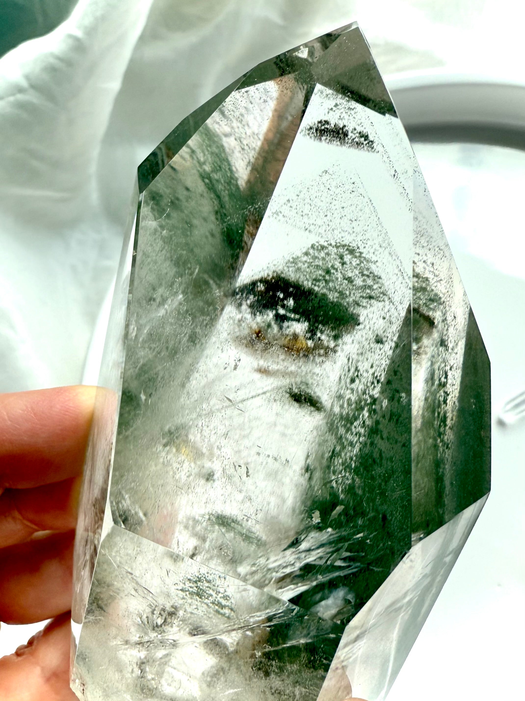 Polished Lodolite crystal point with layered chlorite phantoms and mossy landscape inclusions