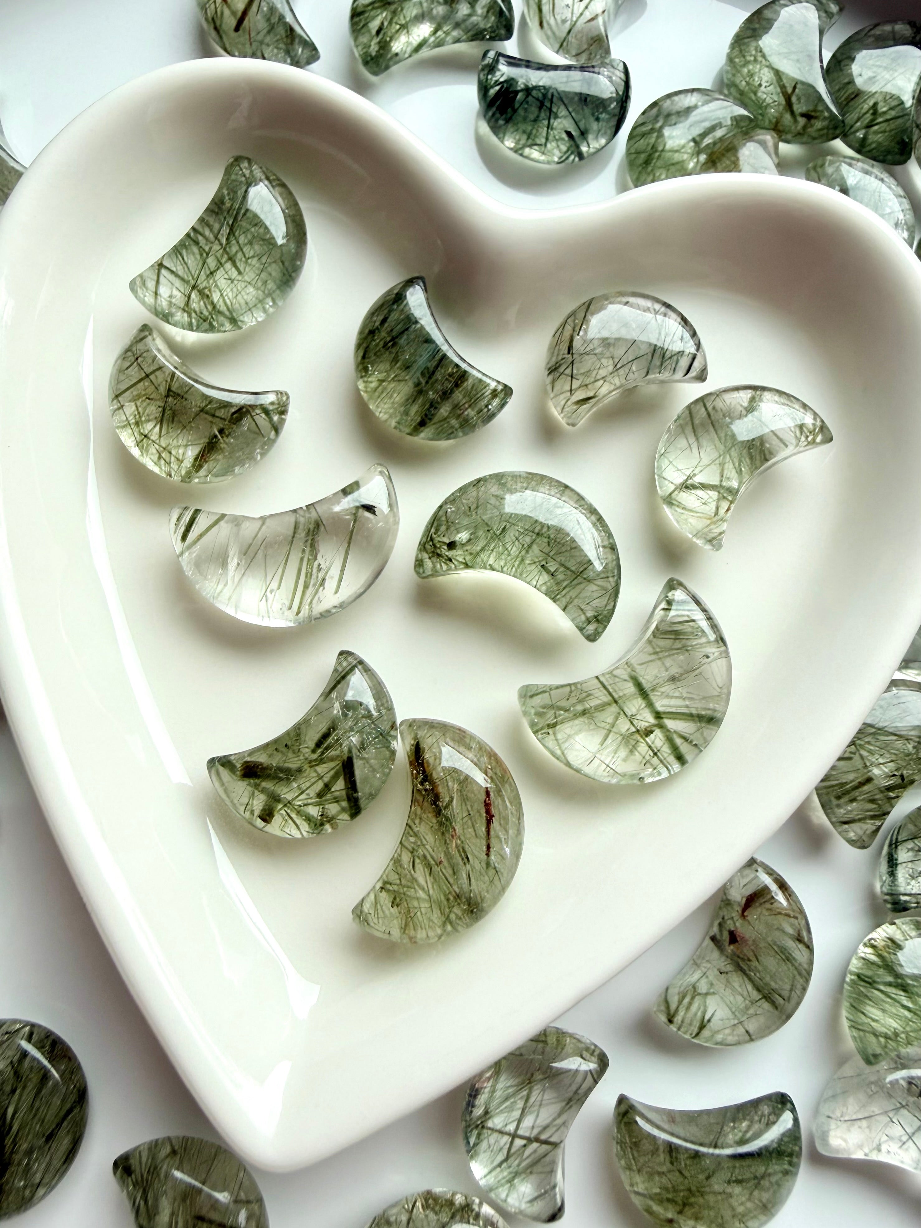 Mini Tourmalinated Quartz moons with green tourmaline needles arranged in a heart-shaped crystal dish
