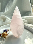 One of a kind pink Mangano Calcite flame displaying natural mineral patterns and calming heart-centered energy
