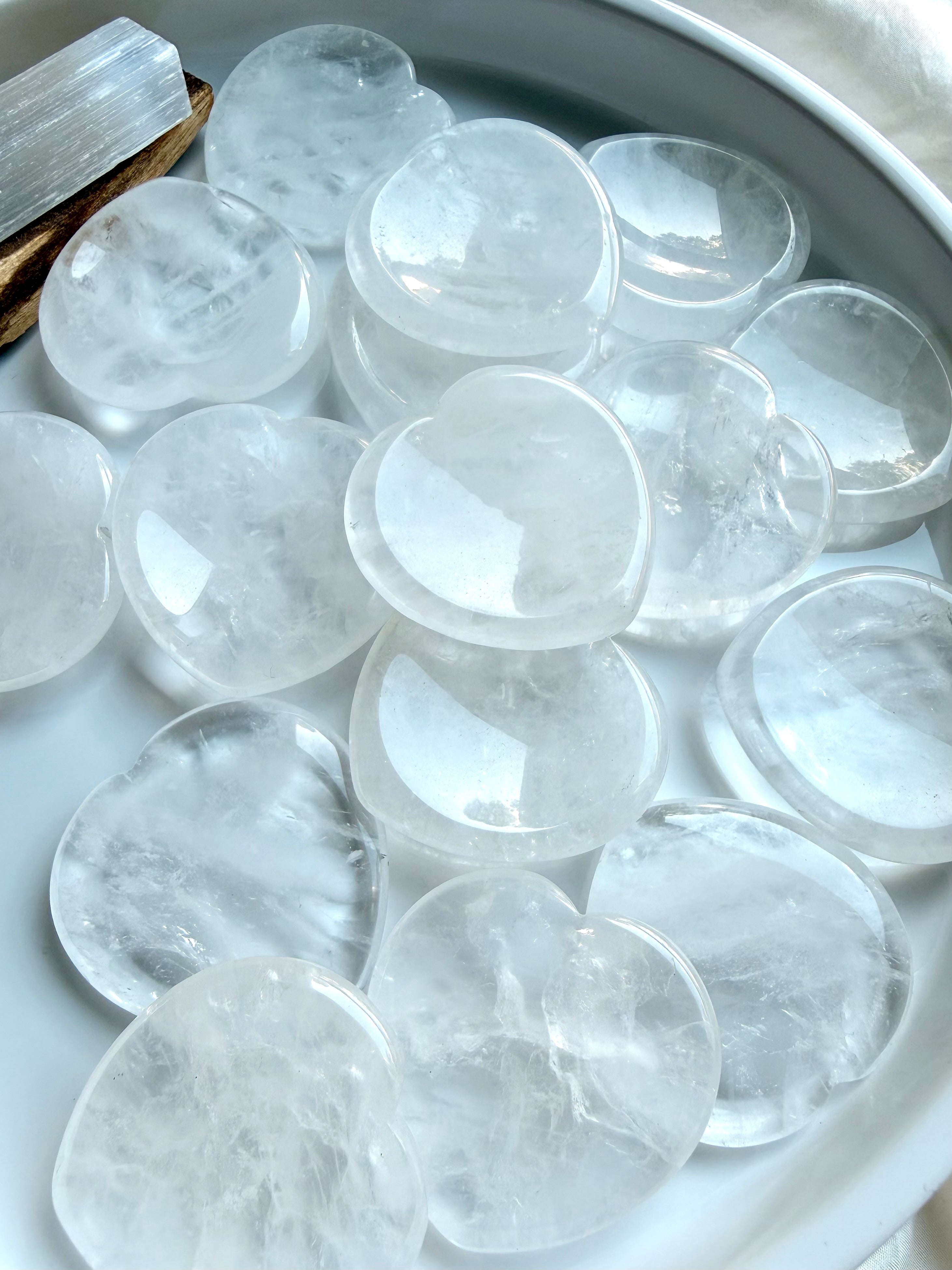 clear quartz heart stones grouped together for clarity focus and energy amplification