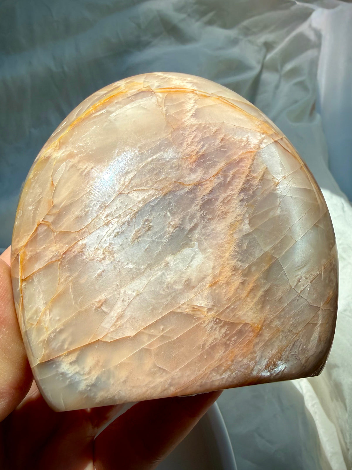 Sunstone shimmer side of Peach Moonstone freeform with sparkling golden aventurescence and warm peach feldspar tones