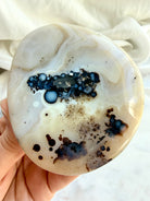Dendritic Orbicular Agate freeform with black mineral inclusions, distinctive circular patterns and creamy white banding 