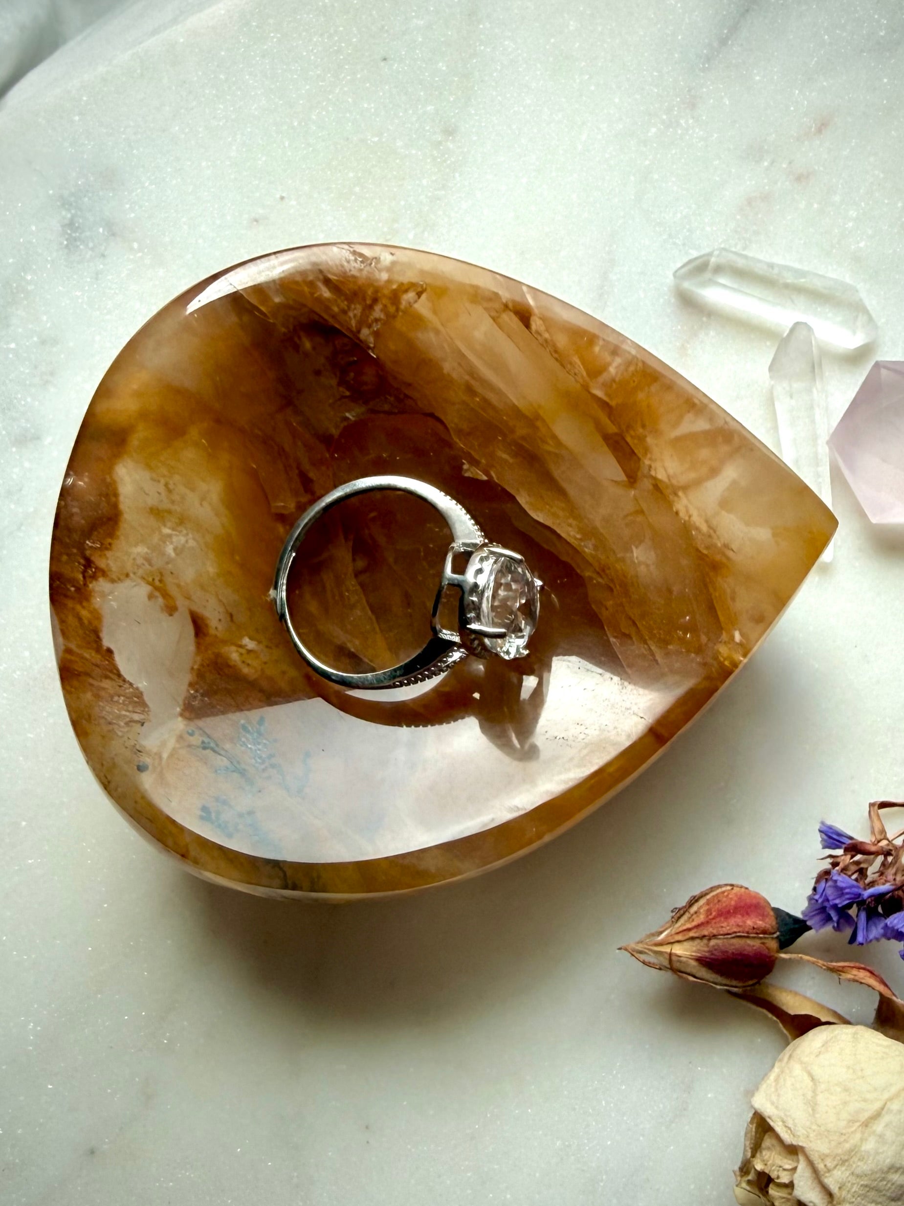 Golden Healer crystal bowl styled with ring, teardrop quartz dish for charging jewelry and altar use
