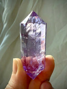 High-clarity Amethyst Vogel cut wand with polished facets and vibrant purple tones