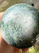 Large Moss Agate crystal sphere with scenic landscape patterns for grounding, abundance, and balance