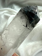 black tourmaline quartz crystal point close up showing black rutile  inclusions and clarity