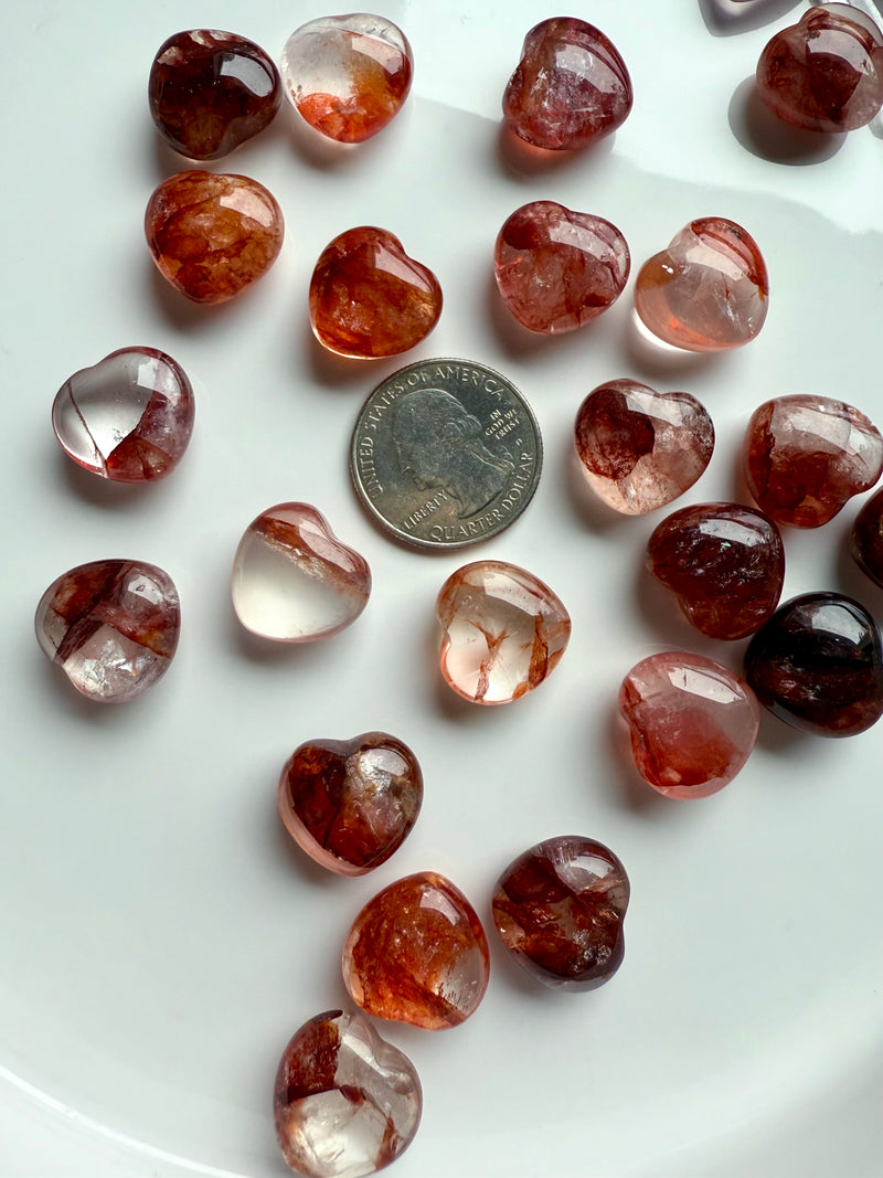 Gemmy, high quality Mini Fire Quartz Crystal Hearts shown with a quarter for scale