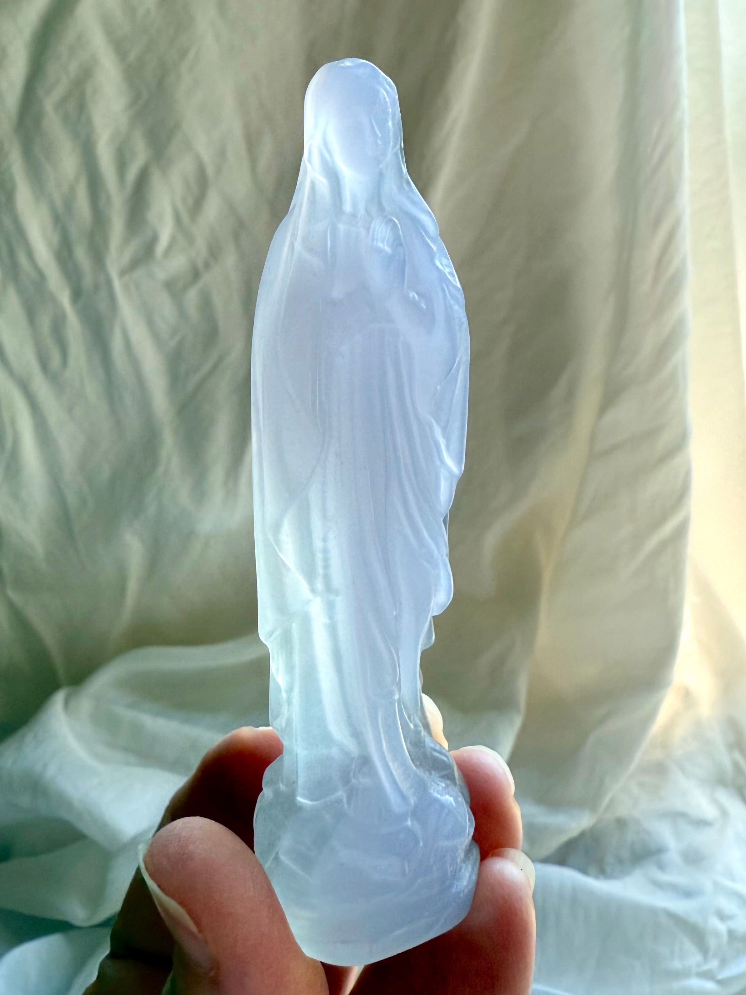 Yttrium Fluorite Mother Mary figurine with softly carved robes and pale lavender crystal coloring