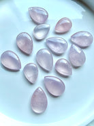 Polished Rose Quartz teardrops in small and large sizes with gemmy clarity and soft luminous pink color