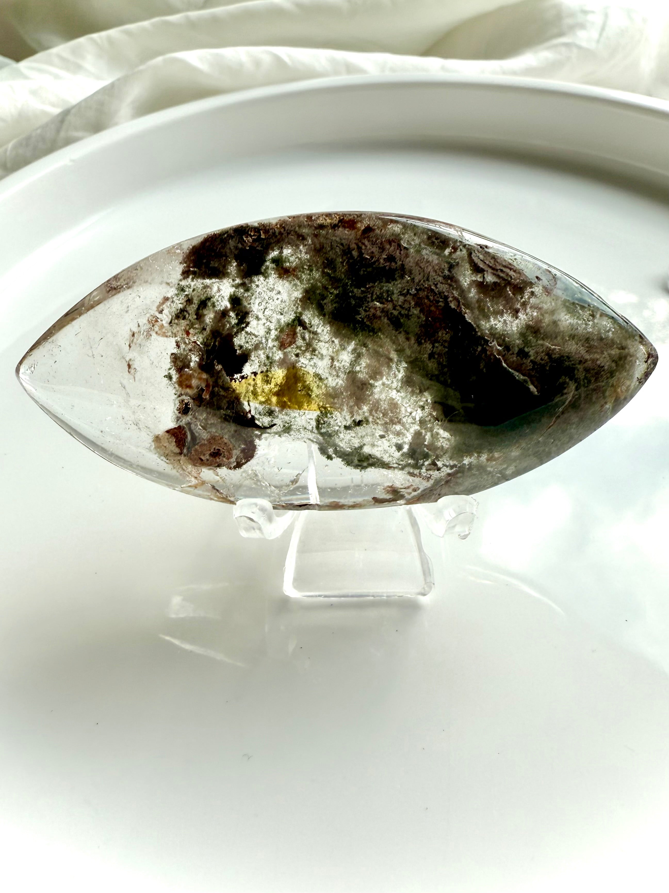 Scenic Garden Quartz crystal lens with mossy inclusions and golden healer tones on white tray