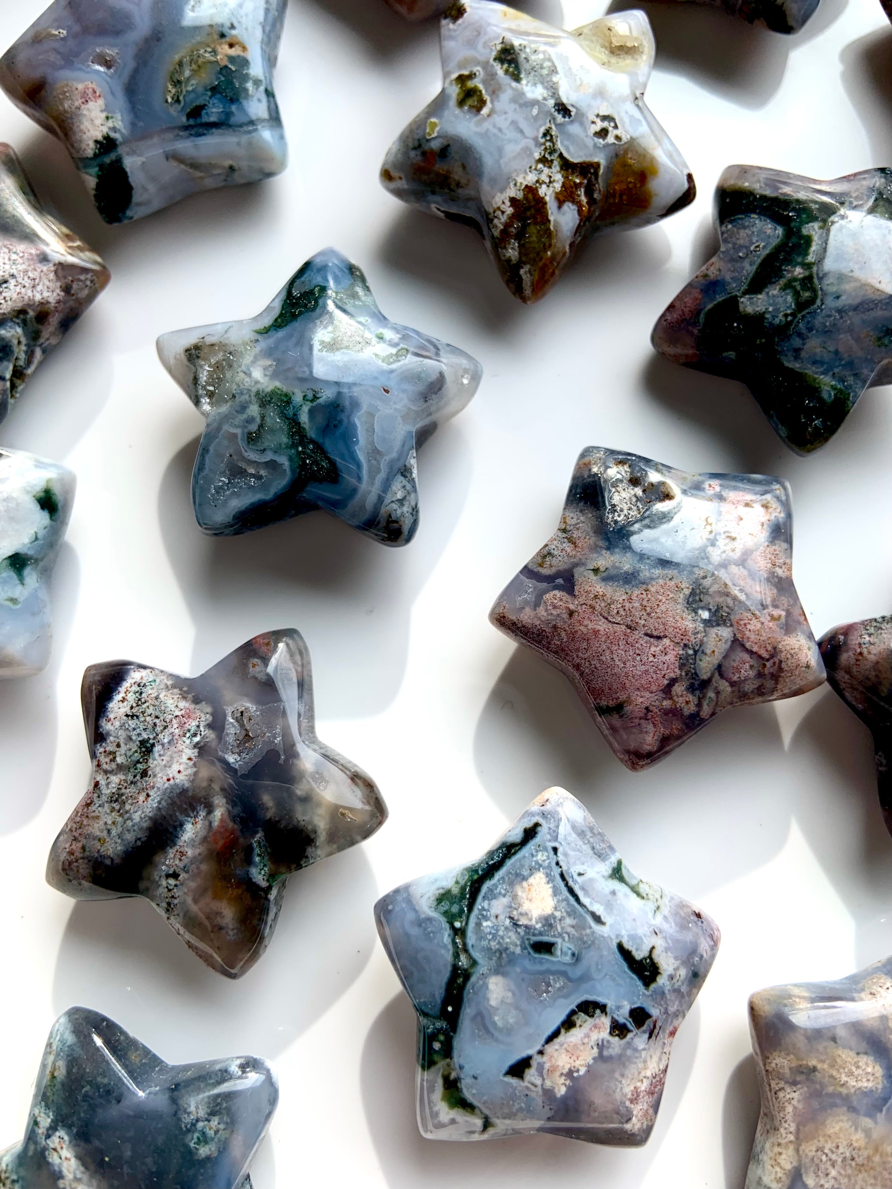 Closeup of Cosmic Ocean Jasper star carvings showing orbicular patterns, rare healing crystals for balance, grounding, and spiritual growth