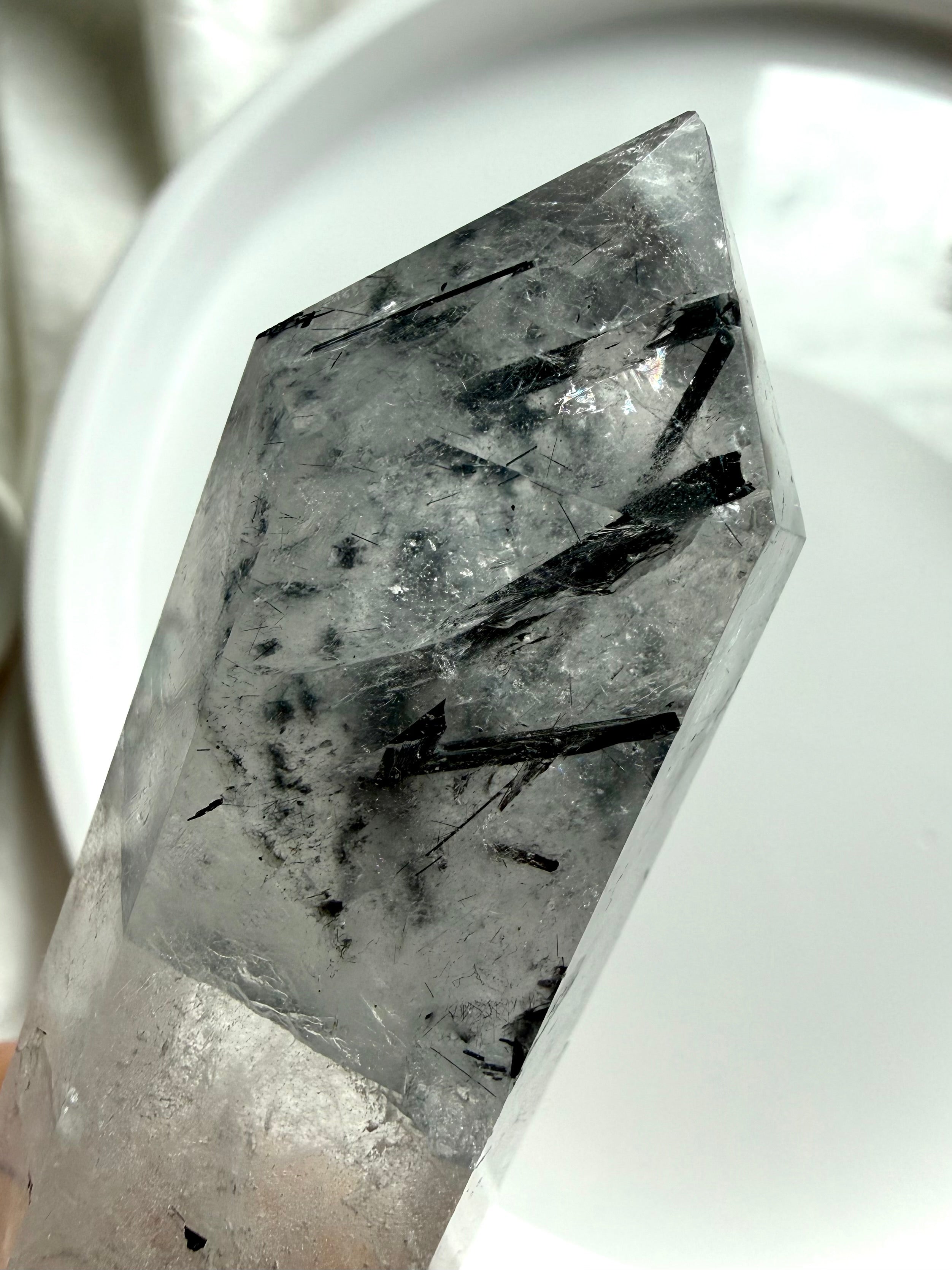 black tourmaline in quartz point tip showing needle inclusions