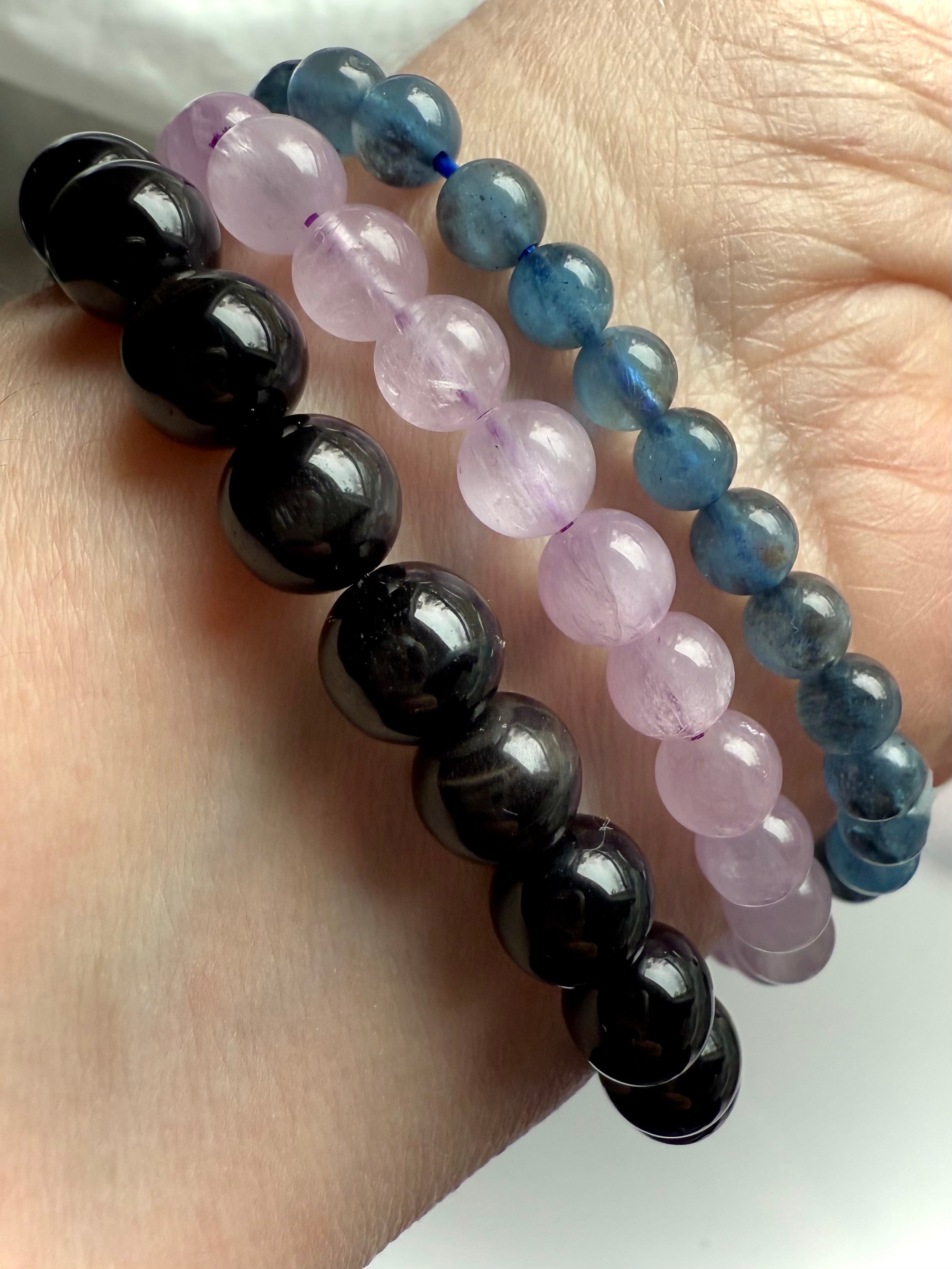 Our Black Tigers Eye Bracelet worn with Devil Aquamarine + Watermelon Lilac Kunzite Bracelets