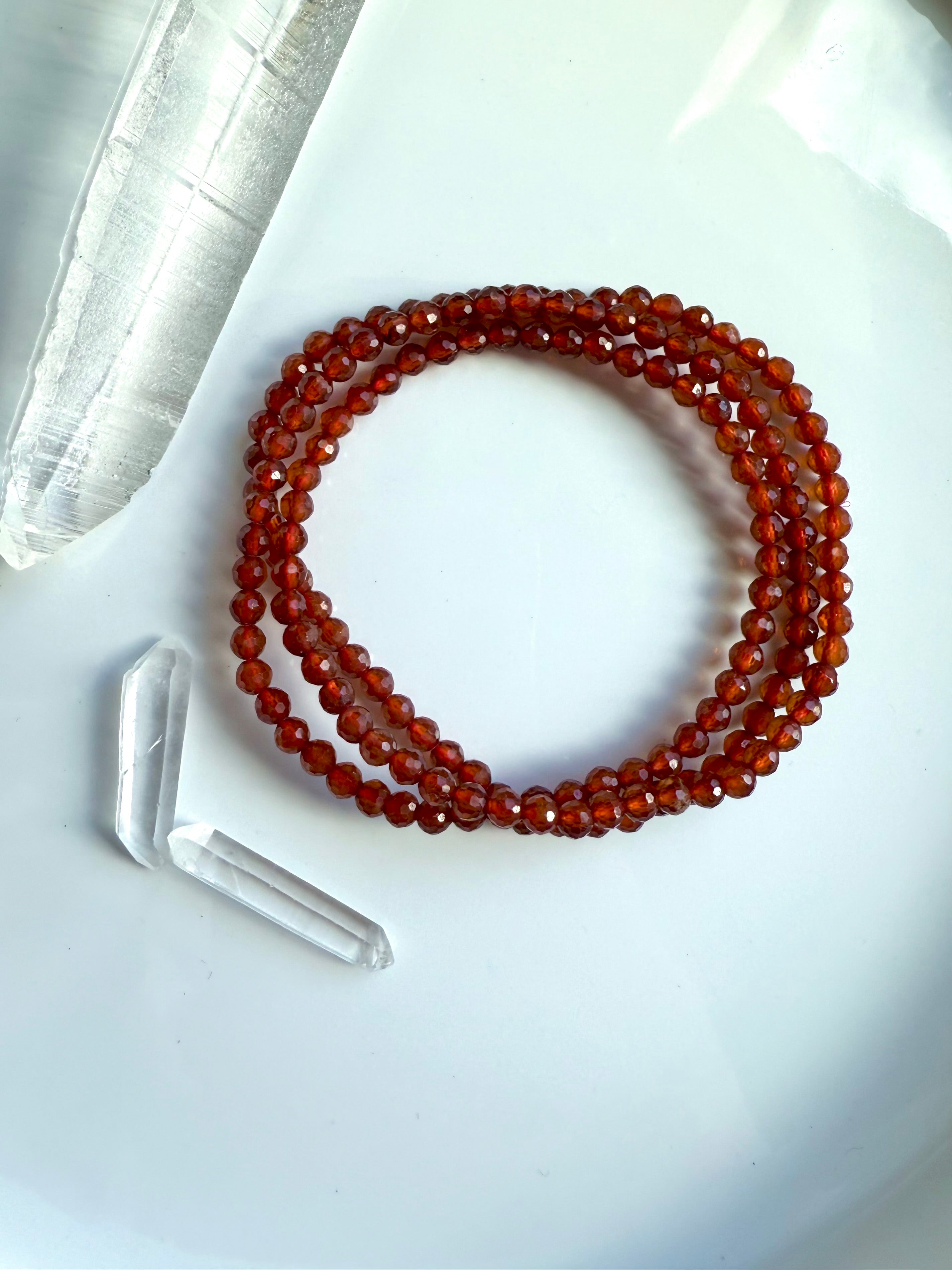 A sparkly faceted Spessartite Garnet Wrap Bracelet with lovely depth of color + gemmy transparency