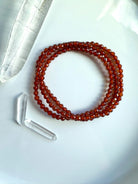 A sparkly faceted Spessartite Garnet Wrap Bracelet with lovely depth of color + gemmy transparency