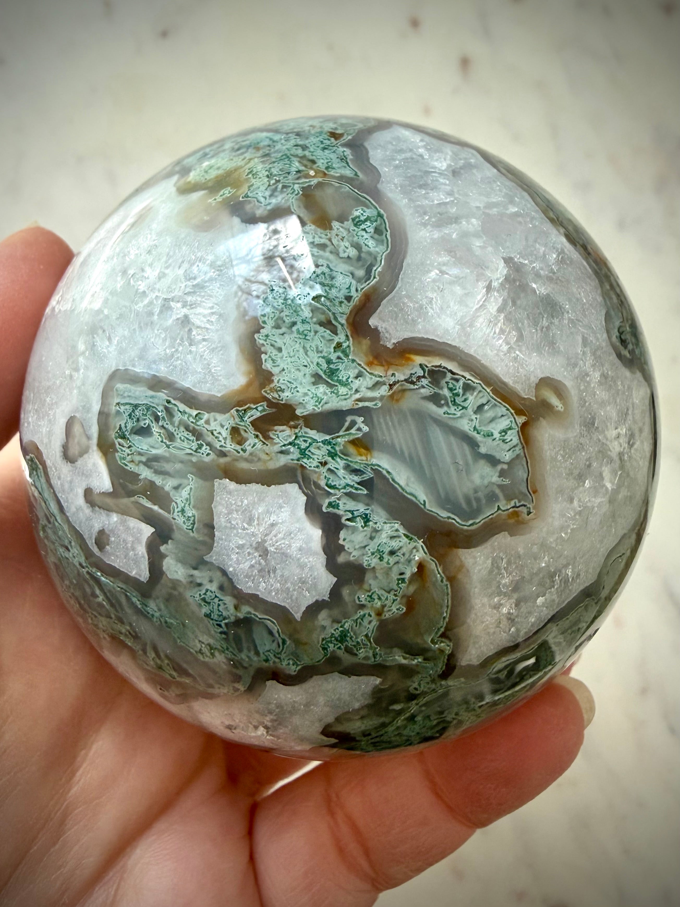 Large Moss Agate crystal ball with white Quartz formations and scenic forest-like mineral inclusions