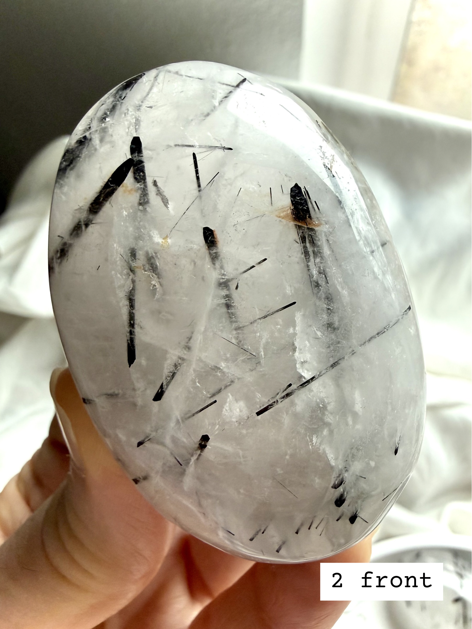 Black Tourmaline in Quartz palm stone 2 front view Tourmalinated Quartz grounding crystal