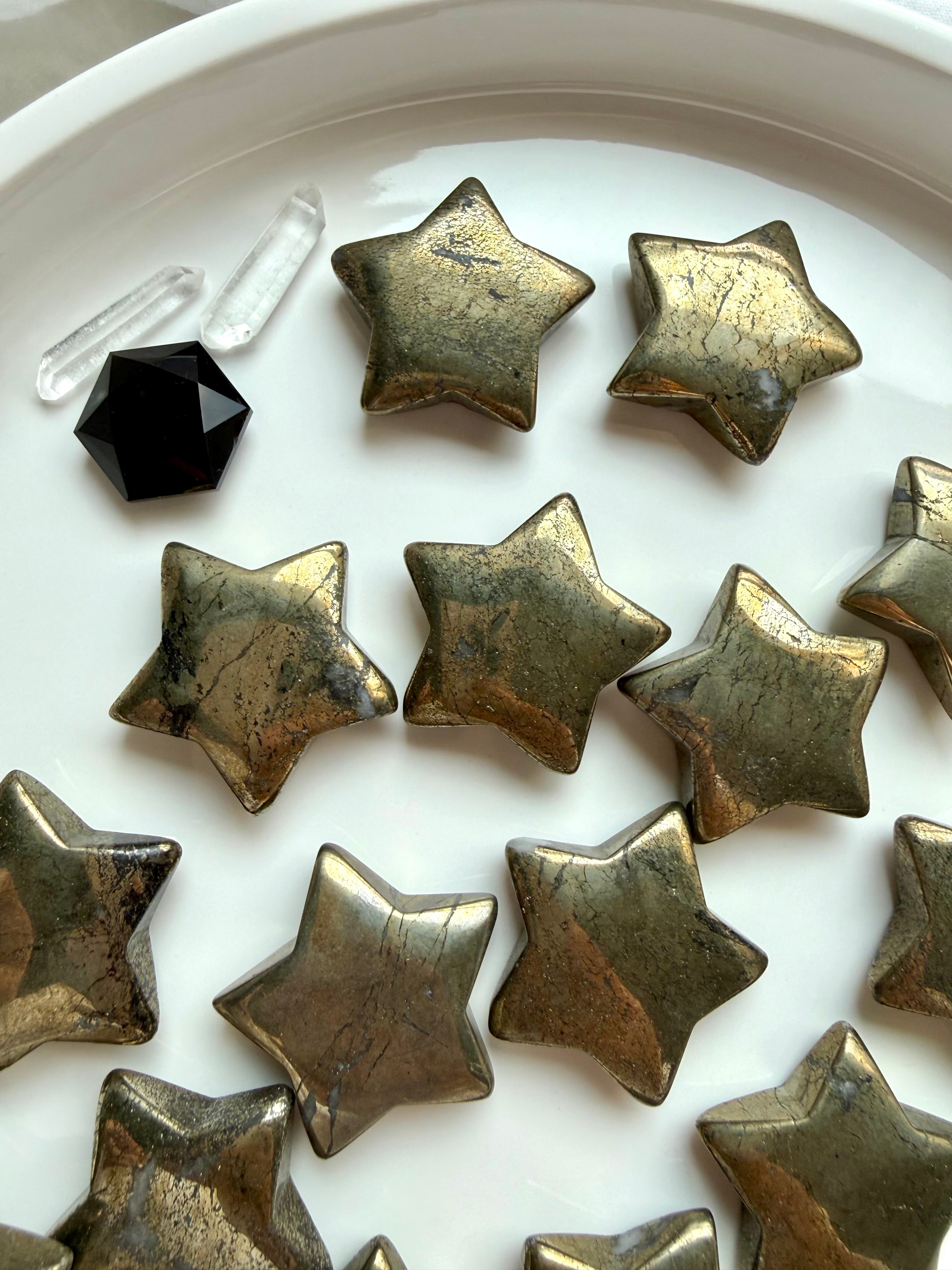 Pyrite stars arranged with Clear Quartz and Black Obsidian crystals for manifestation and energetic protection