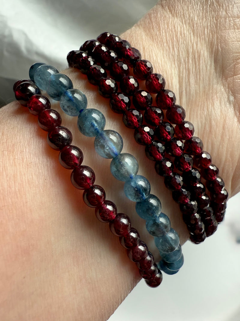 Deep blue Aquamarine Bracelets worn with faceted garnet wrap bracelet + garnet round bead bracelet