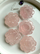 Rose Quartz Lotus Flower crystal carvings arranged on white tray – Heart Chakra stone for love, calm energy and sacred space décor