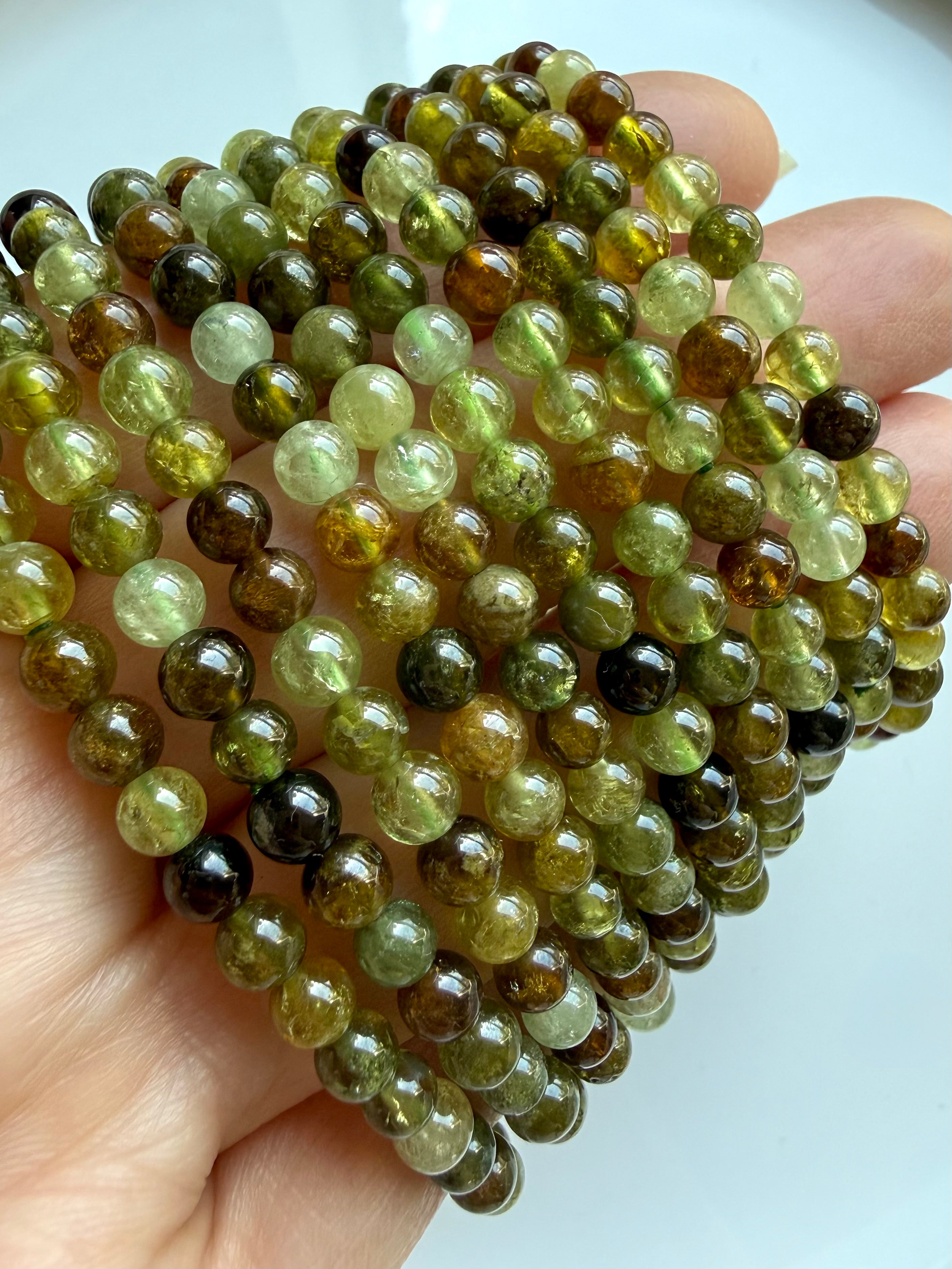 Transparent Tsavorite Garnet bracelets with luminous green crystal gemstones and earthy luxury aesthetic