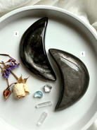 Pair of Silver Sheen Obsidian moon carvings highlighting natural variation, grounding crystals for clarity and intuition
