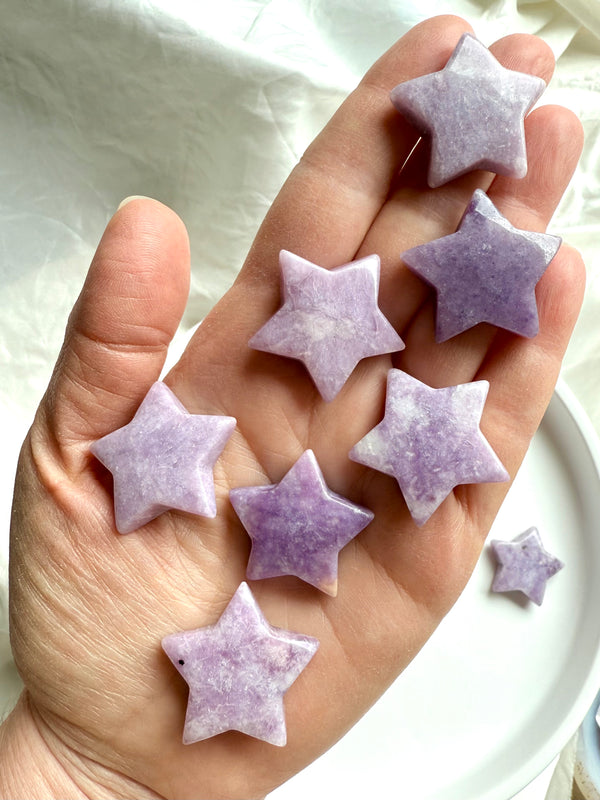 lilac lepidolite stars crystal on my hand – calming stone for stress relief and heart chakra energy