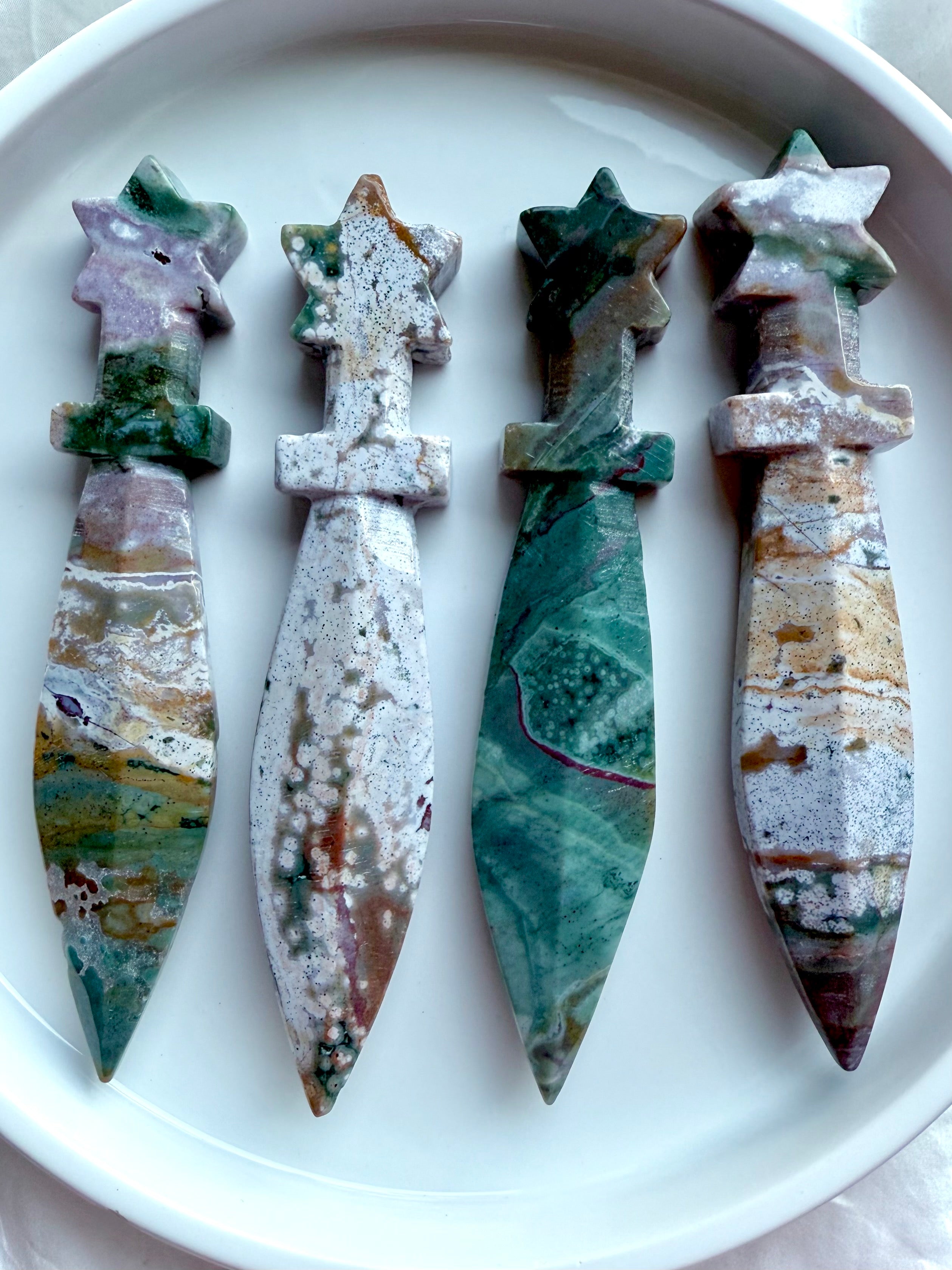 Ocean Jasper star knives – crystal athames with celestial star handles and polished stone blades, shown together in group display