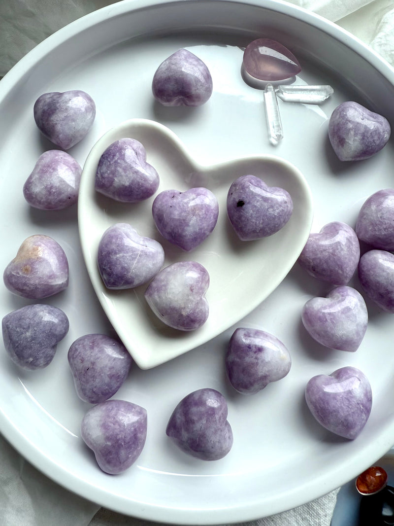 Purple Lepidolite heart carvings make a soothing pocket stone for stress relief + emotional support