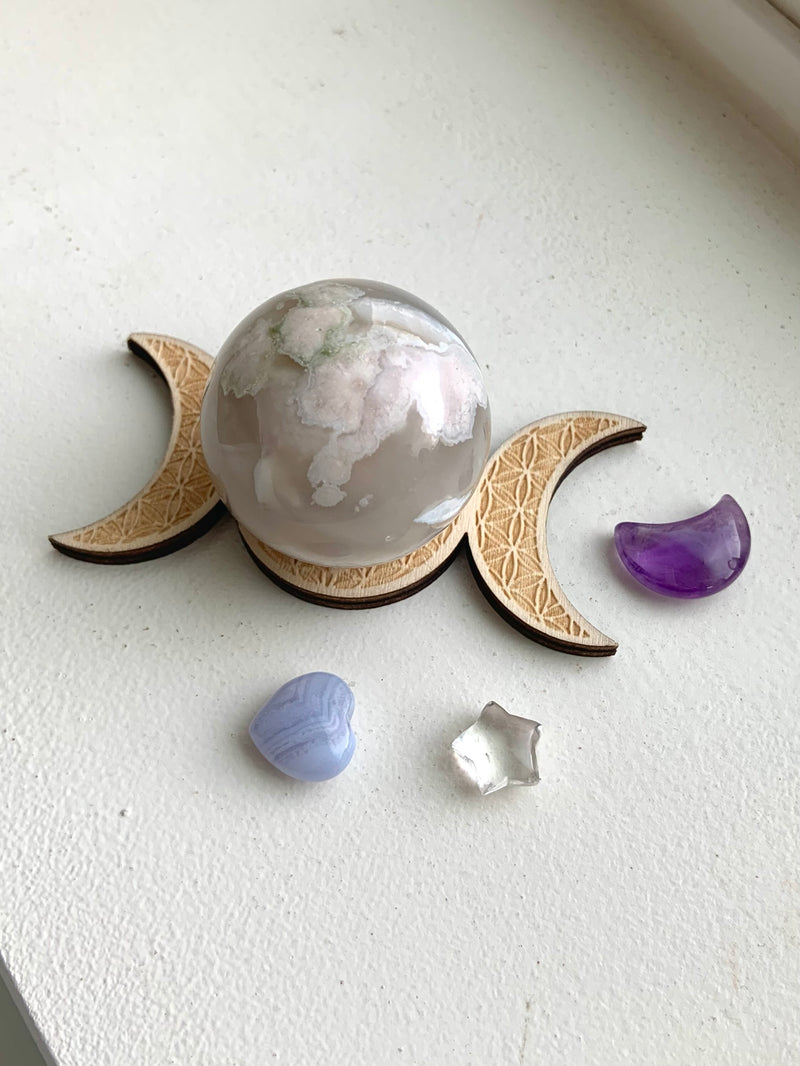 Crystal Bundle Gift Set includes a flower agate sphere with moon phase holder, an amethyst moon, blue lace agate heart, and clear quartz star.